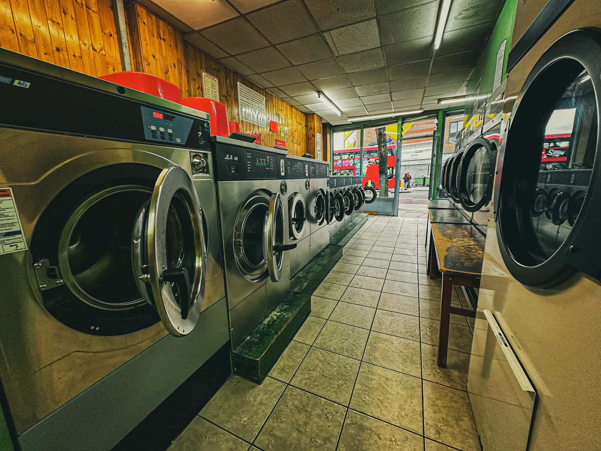 Professional industrial washing machines at H&M Laundrette - commercial laundry facility in Tooting